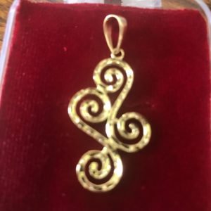Solid 14k and 10 k gold Swirly-Curly Pendant.